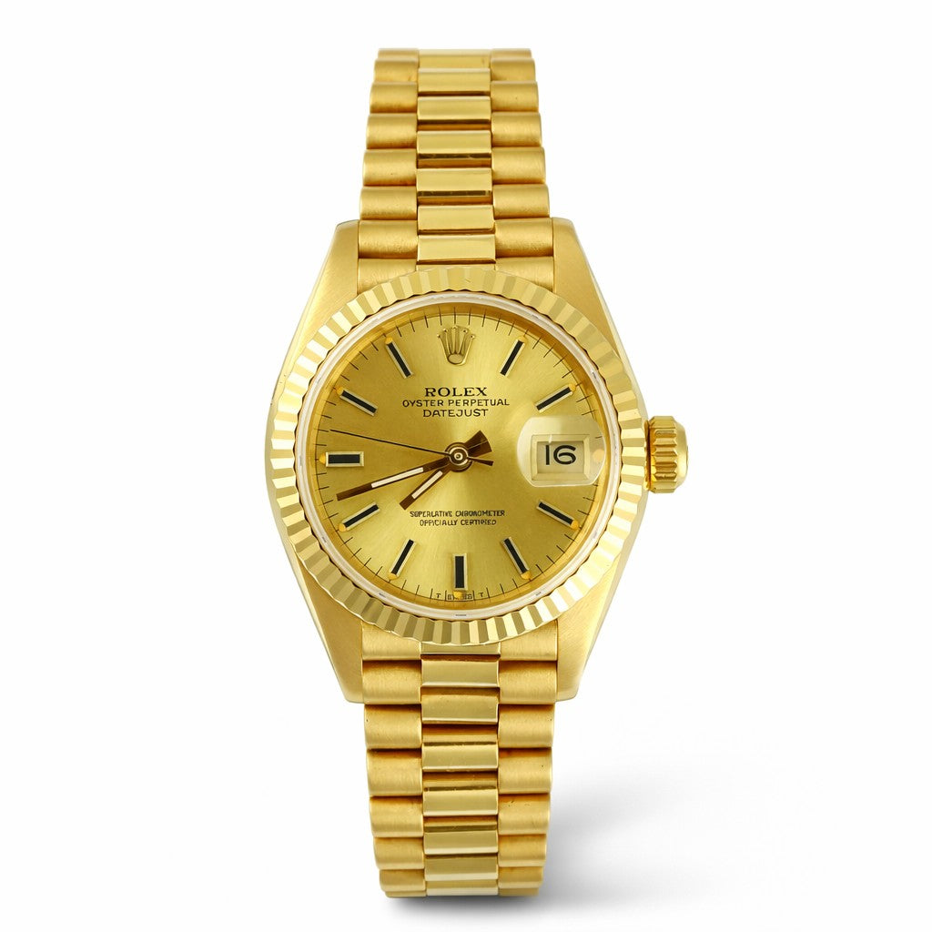 Gold Rolex watch on a white background
