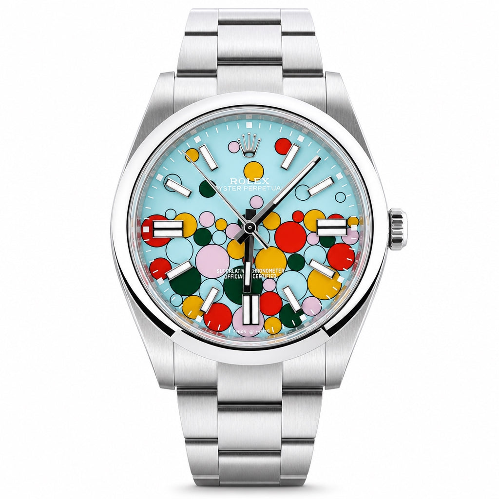 Rolex Datejust watch with a stainless steel Oyster bracelet and a light blue dial decorated with colorful bubble graphics.