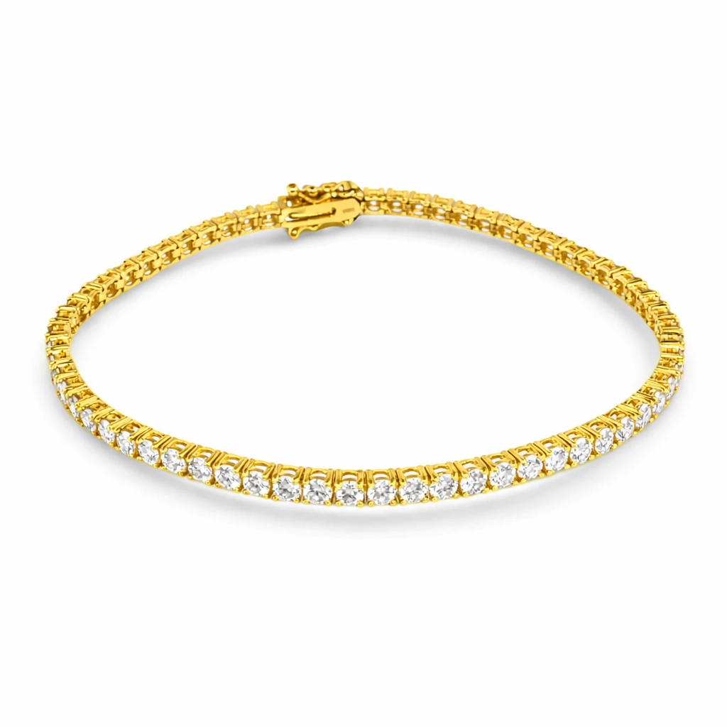 Gold bracelet with clear stones on a white background