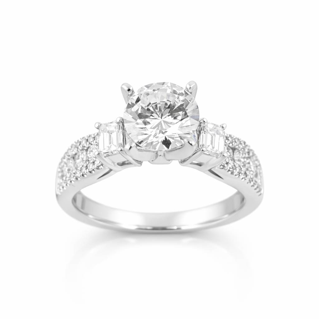 Diamond ring with a central gemstone and smaller stones on a white background