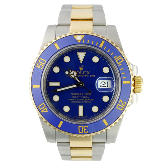 Two-tone watch with blue face and gold accents on a white background