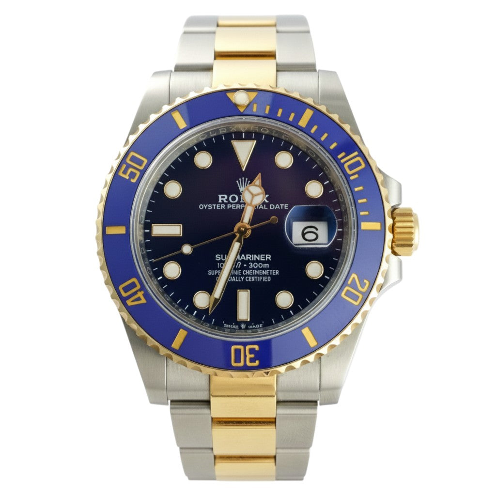 Luxury watch with blue and gold casing on a white background