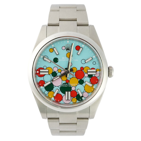 Silver watch with a colorful circular face on a white background