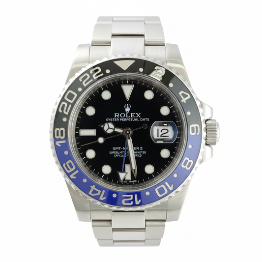 Rolex watch with black face and blue bezel on a white background