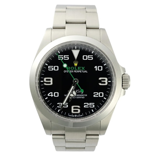 Silver Rolex watch with black dial on a white background