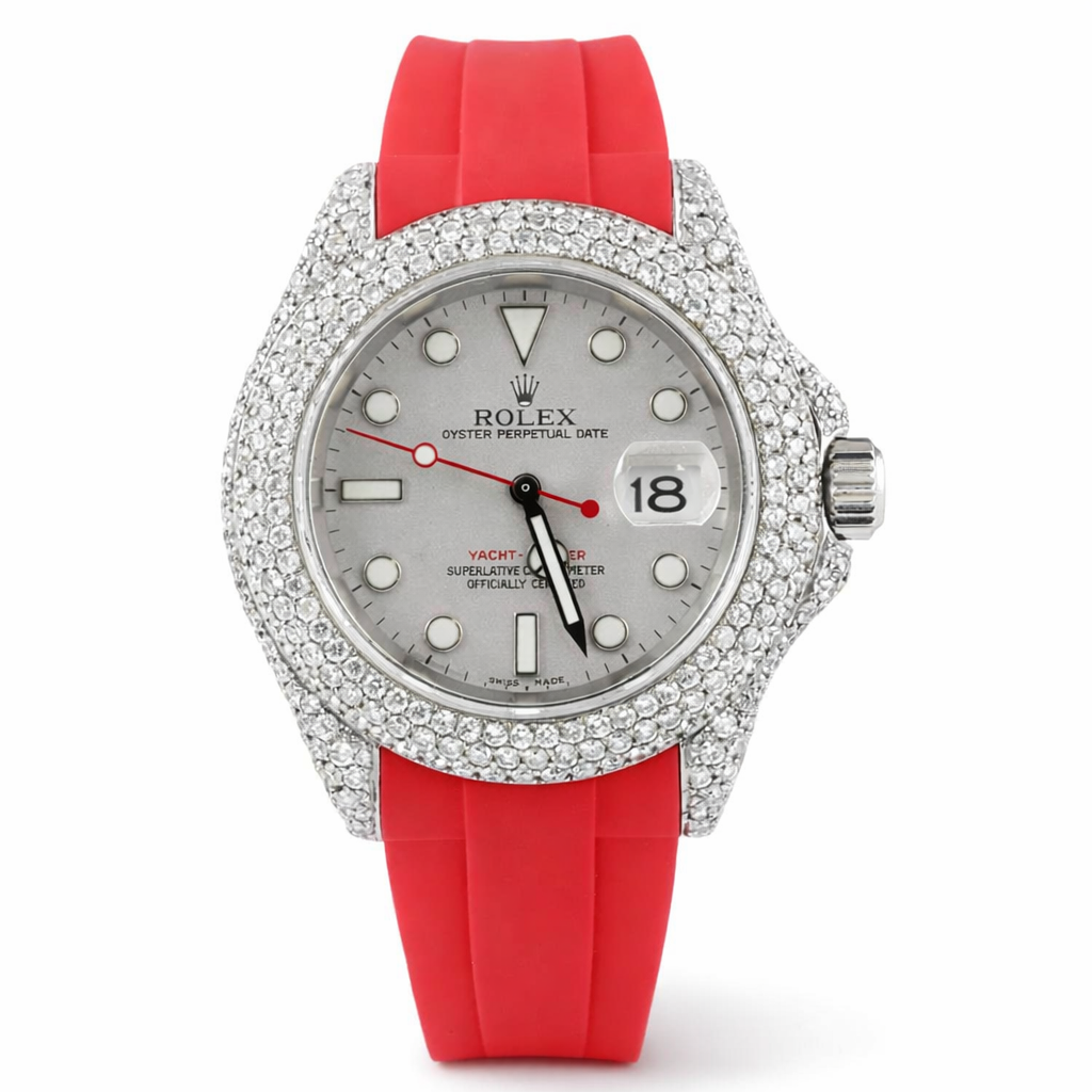Rolex watch with red strap and diamond-studded case on white background