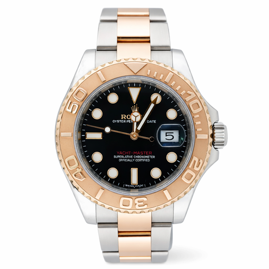 Luxury watch with black dial and rose gold and silver case on white background