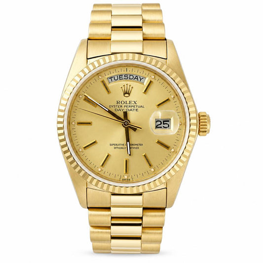 Rolex Day Date watch with a gold-tone stainless steel case, fluted bezel, and gold dial with a day and date window.