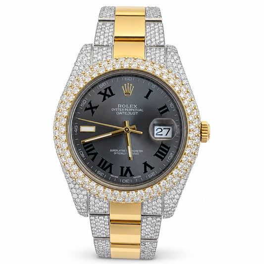 Rolex Oyster Perpetual Datejust watch with a two-tone yellow gold and silver-tone Oyster bracelet, a diamond-encrusted bezel, and a dark gray dial with Roman numerals.