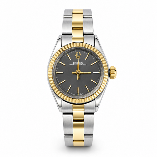 Two-tone silver and gold watch with a black dial on a white background