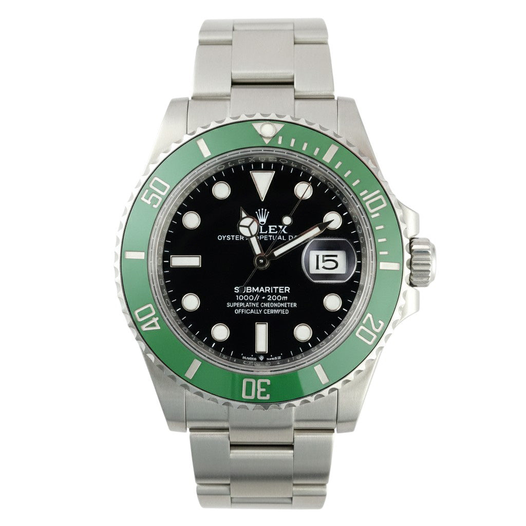 Rolex watch with green bezel and silver bracelet on a white background