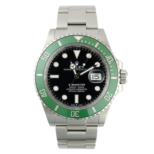 Rolex watch with green bezel and silver bracelet on a white background