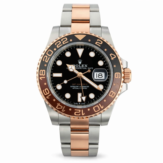 Luxury watch with black dial and rose gold accents on a white background