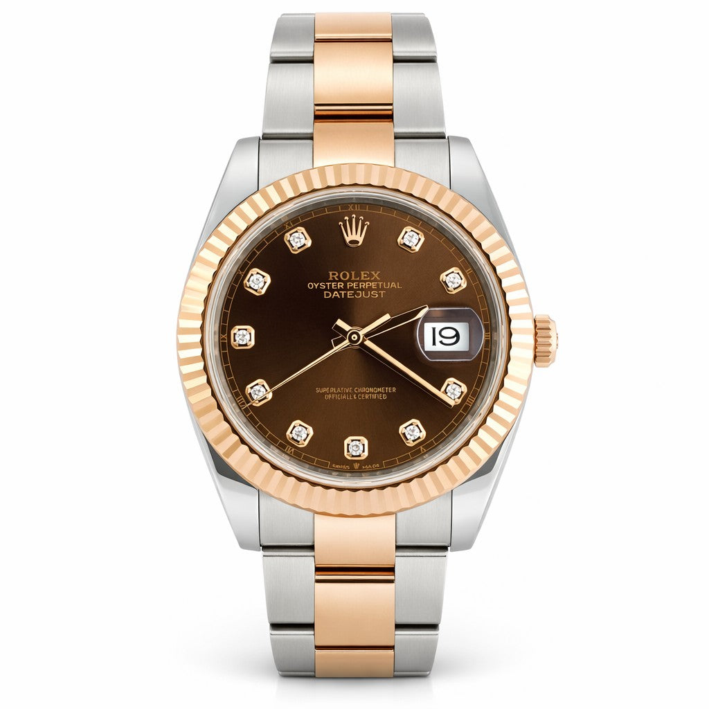 Luxury watch with two-tone rose gold and silver band on white background