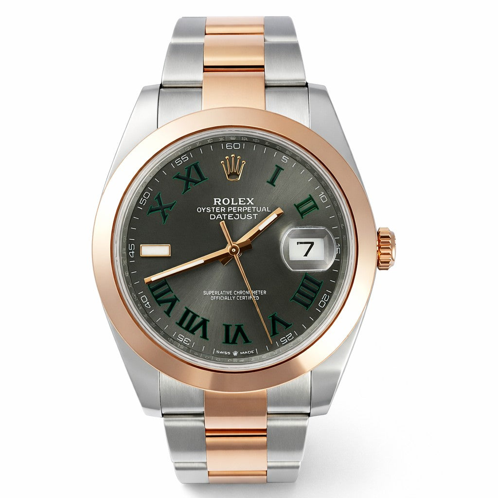 Luxury watch with silver and rose gold case on a white background