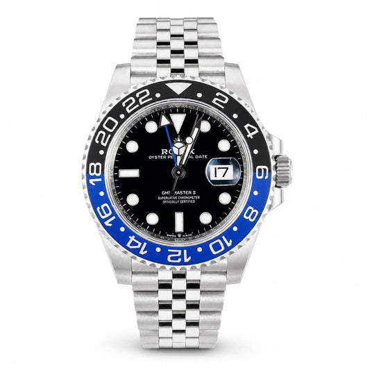 Rolex watch with black face and blue bezel on a white background